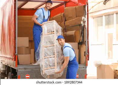 loaders-taking-furniture-truck-outdoors-260nw-1892807344.jpg